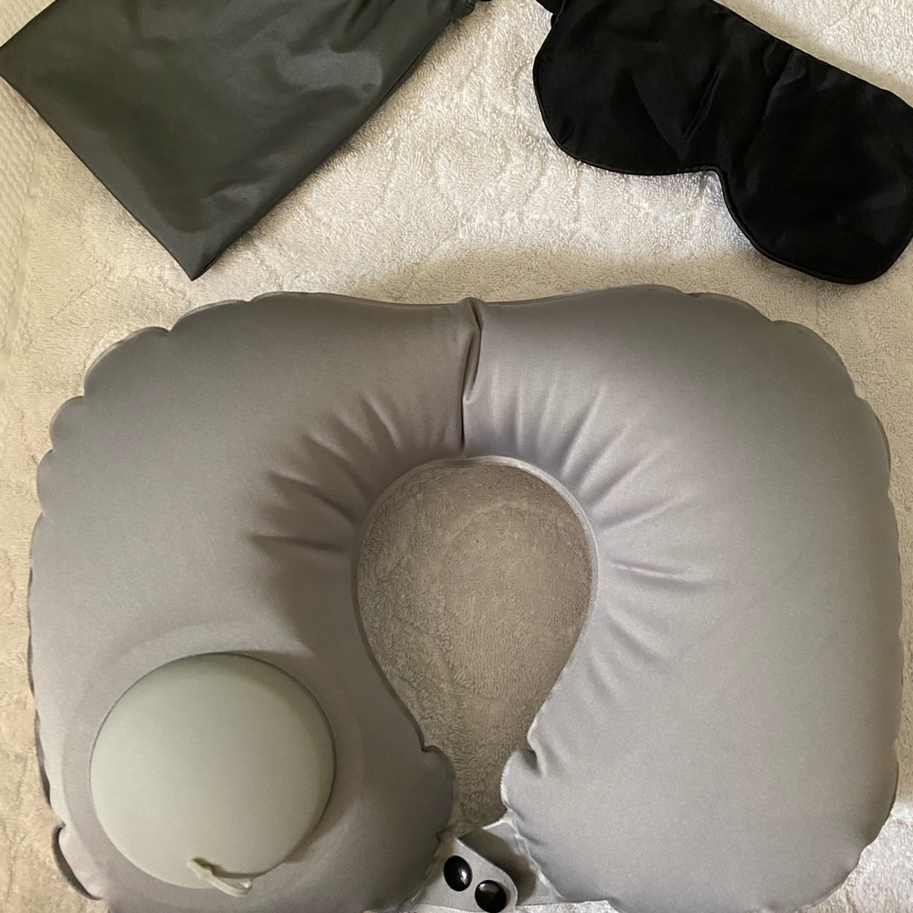 Inflatable travel neck pillow that includes case and eye mask
